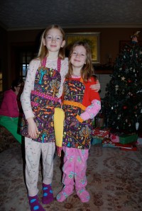 Grandma made Sylvia, Lily and me matching aprons!