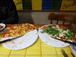 Pizza!  One with Maltese cheese and sausage, the other with proscuitto, rocket (arugula) and shaved Parmesan.  
