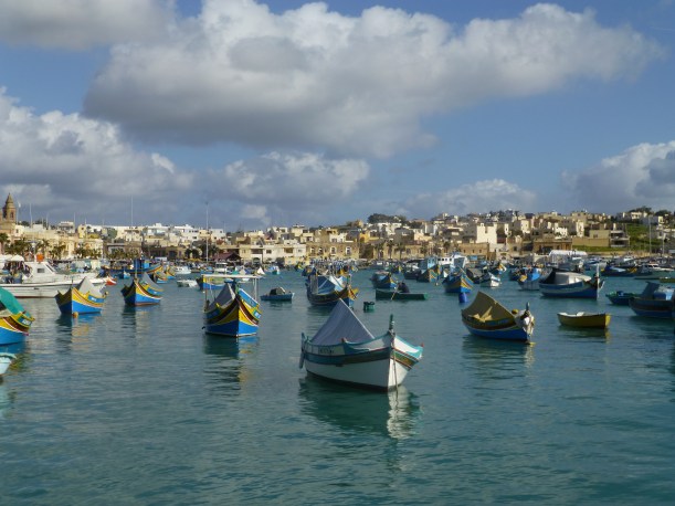 Looking out over the bay to the other side of the town.  The fishing boats are so colorful!