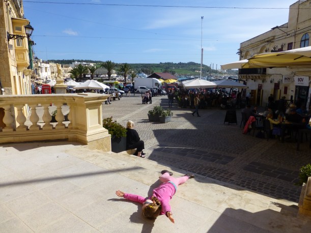 Lily, soaking up the sun.  You can see the plaza where we we had lunch and that leads right to the market and the water.