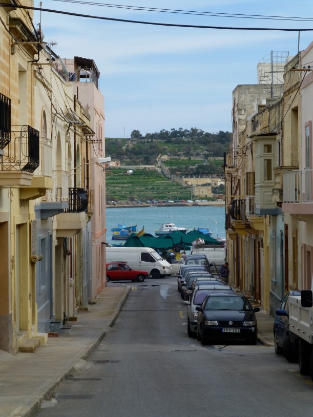 One last view of the water and green hillside as we walk toward the bus stop.