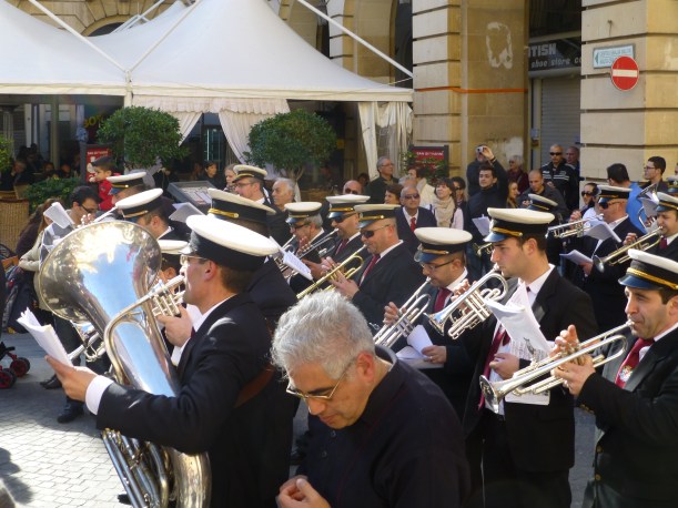 People walked along the band or trailed behind, cheering and enjoying the music.