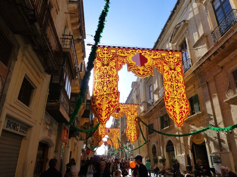 The streets were decorated with huge banners in bright, cheery colors.