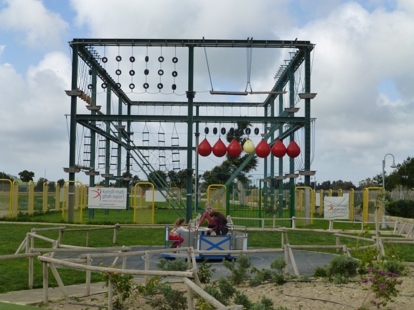 Last stop of the day, a huge playground at the National Park.  The girls played for a couple hours.  Behind them is a high ropes course.