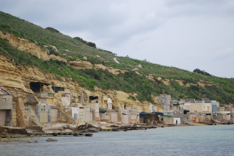 These houses appear to be built into the side of the hill.  I don't know if they are year round residences.  I didn't not see any boats, but there were docks in front of the houses.