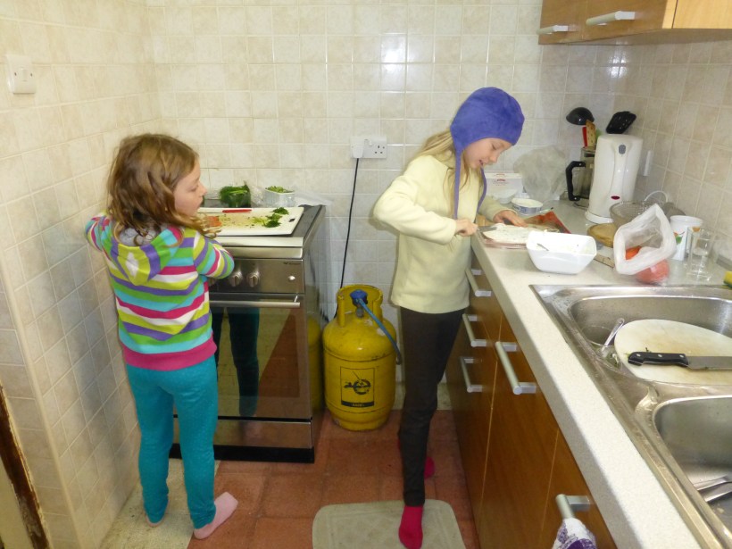 Continuing down the hall a bit, we come to our small but functional kitchen.