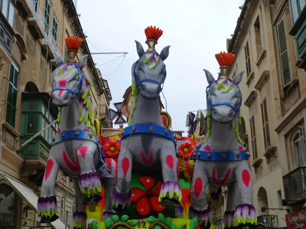 We went back on Sunday morning with Jon.  We were hoping for a parade, but instead we saw more huge floats, beautiful costumes and tons of people.