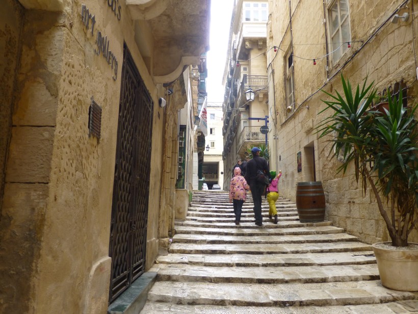 Taking the back road to the bus terminal to avoid the crowds and loud music.