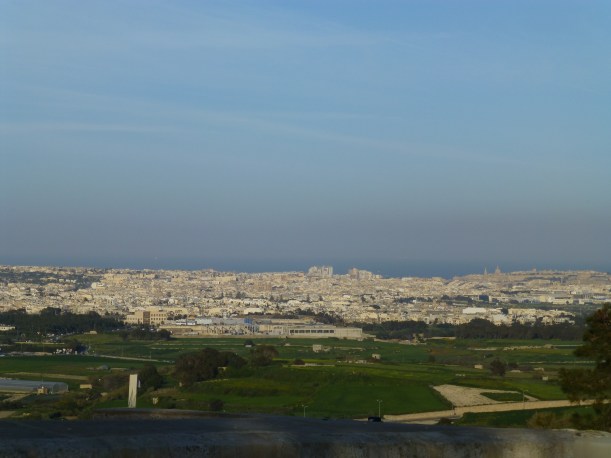 I'm always suprised to see the sea from other parts of the island.  You can see Sliema in the middle of the horizon with the tall buildings.