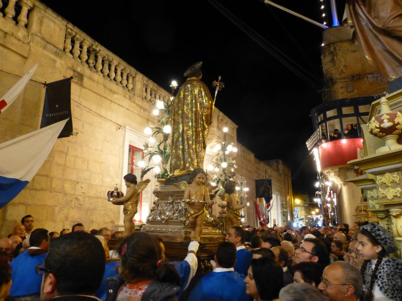 There he goes...8 men carry the statue around the streets with people cheering and singing as the statue goes by.  It was really quite a sight.