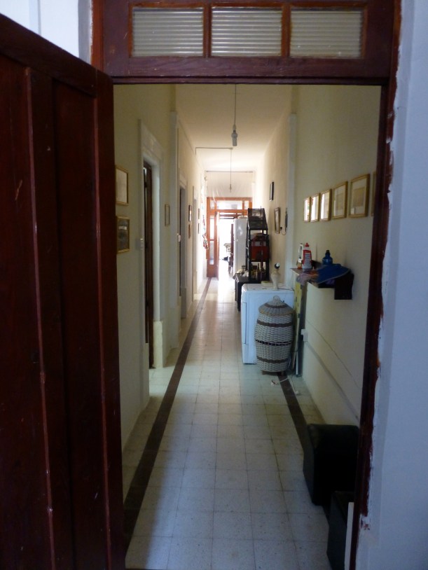 And there, standing in our bedroom door, I can look all the way down the hall to the home school room and the front of the flat.