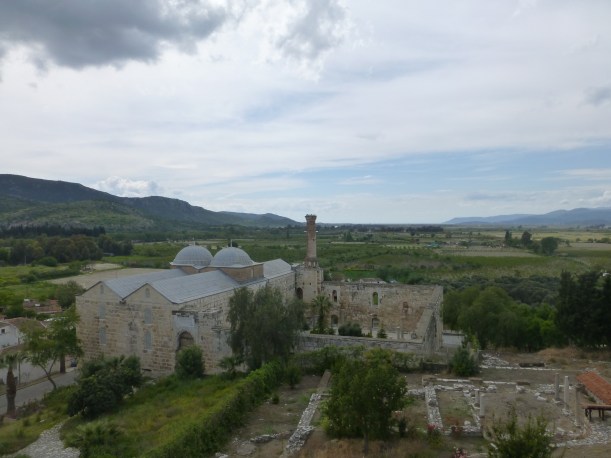 View from the Basilica, looking toward the Aegean sea.  At one point, the sea came all the way to the buildings.  The building with the 2 domes is an active mosque.