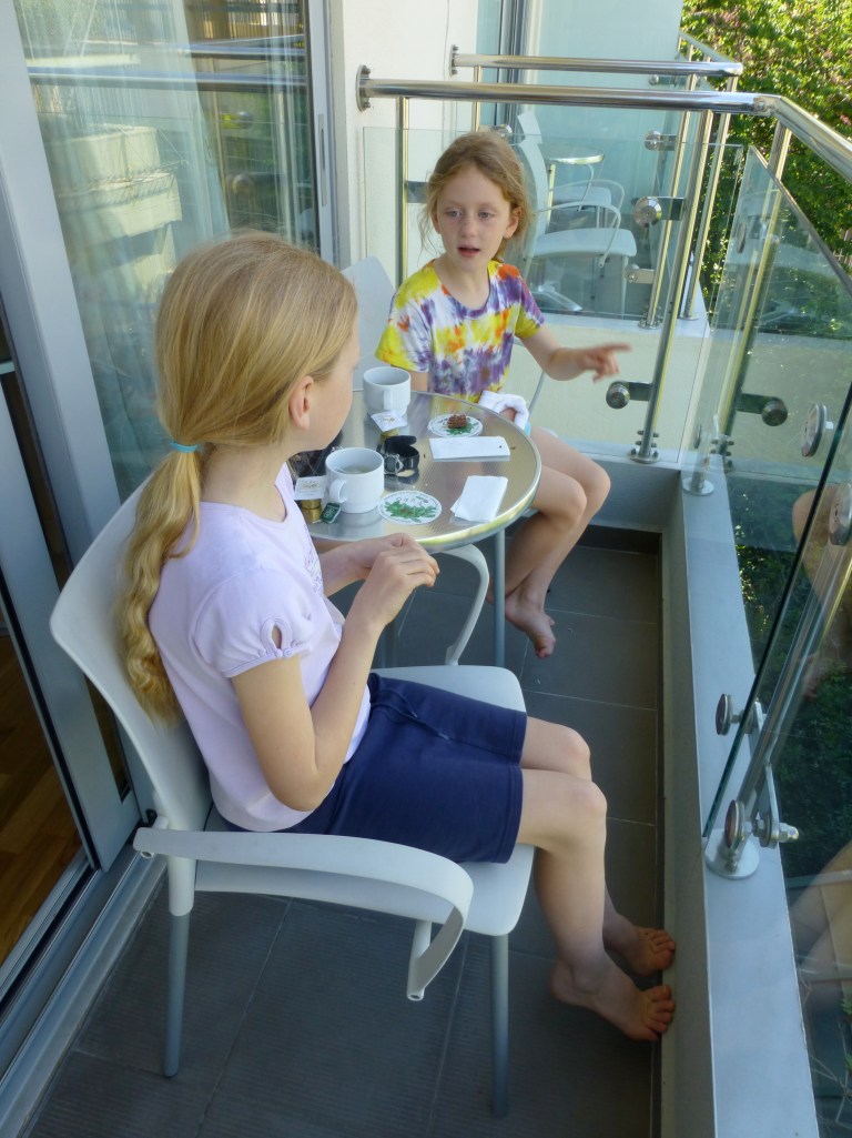 The girls were excited to spend some time at the hotel drinking tea and discussing the history of Athens on the balcony.