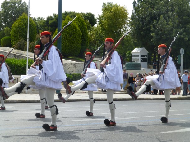 We watched the changing of the guard at the Parliament building. These young men are a part of Greece's military - every young man serves a year.  These young men are specially chosen to be the Parliament guards with their 1840s  replica uniforms.