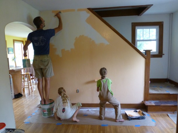 Painting!  Before unpacking all our stuff that was boxed away in the attic, we decided it was finally time to paint the living room and play room.