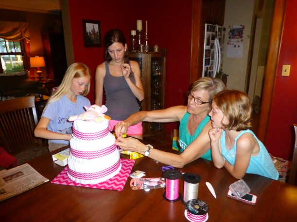 We spent a week in Lincoln to see my family and attend two baby showers for my sister who is going to have a baby very soon!  The girls are helping create a diaper cake.