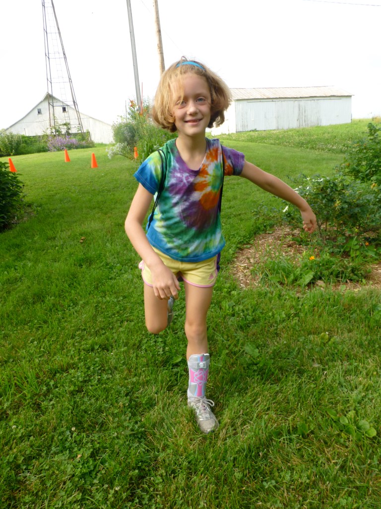 Lily just finished a week of soccer camp. She learned to dribble, shoot and pass. She had a lot of fun - and snack was her favorite part of camp. :)