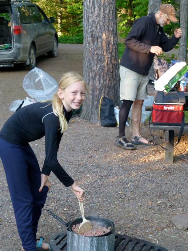 Sylvia loves to help cook - even around a camp stove!