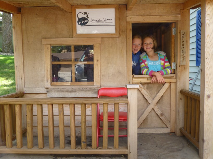 The girls had fun playing in the little play house again.