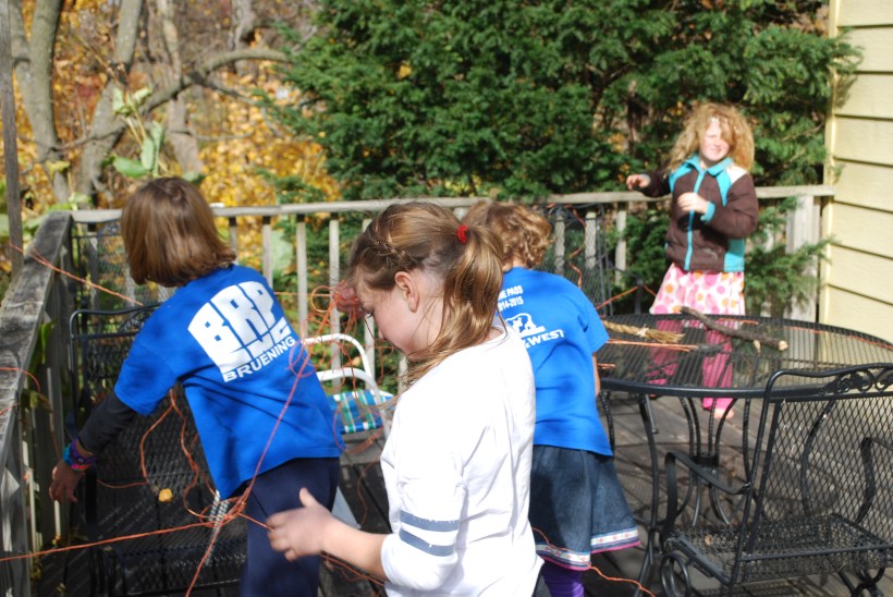 The party started with Cobweb Confusion.   All the kids had to follow their string to find their goodie bag.