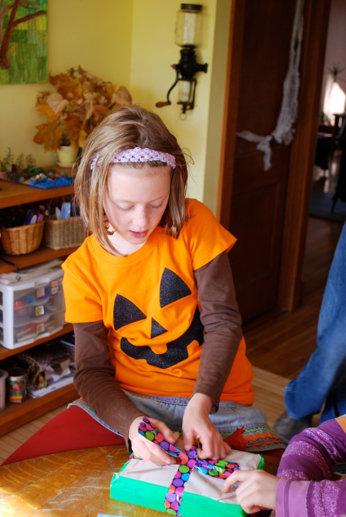 Opening presents - books, rice bags, a fairy lunch box, homemade play dough, stickers and pictures!