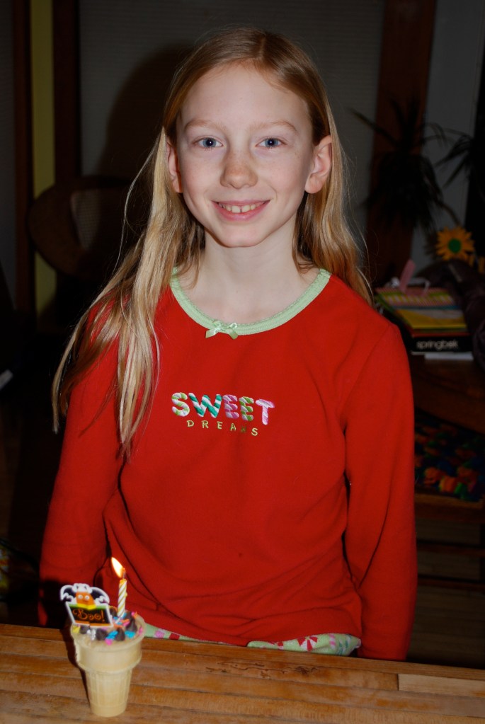 Sylvia turned 10 on January 16th.  Double digits!  Lily made her desert: raw shortbread dough in an ice cream cone with chocolate chips and sprinkles on top.  Lily said that they LOVE raw dough but I never let them eat enough and this recipe didn't have raw eggs in it, so it would be fine to eat a lot.  :)  Sylvia loved it!