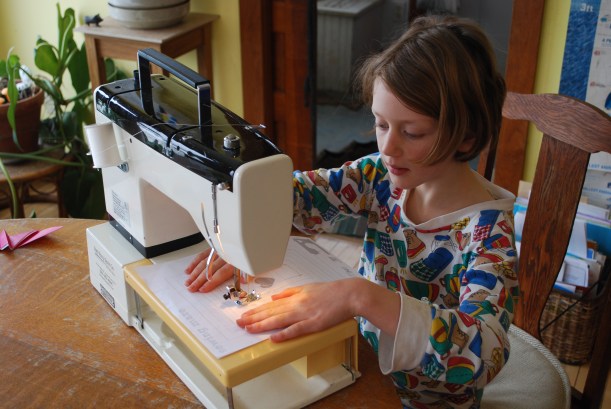 The girls got a little practice sewing before starting in on the bookmarks.