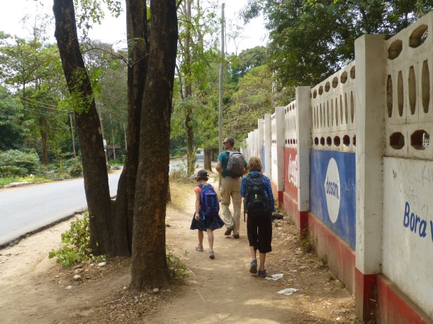 Walking through a wealthy neighborhood (complete with razor wire around the walls)  in search of the beach.