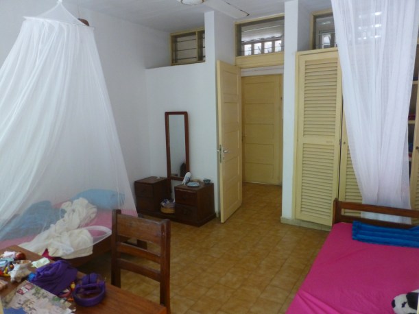 This is our bedroom. We have to sleep under bug nets every night. Lily's side is the messy one.