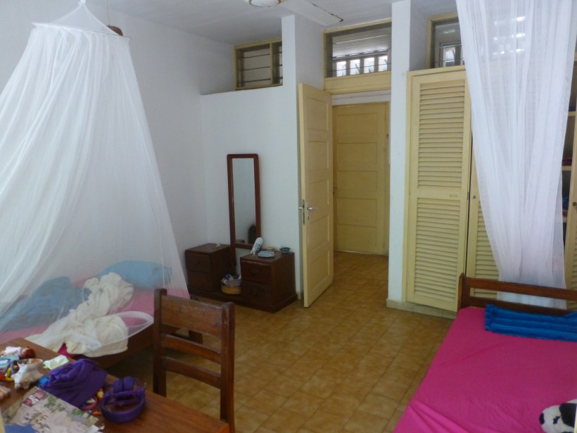 This is our bedroom. We have to sleep under bug nets every night. Lily's side is the messy one.