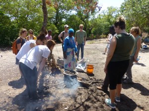 And here we are learning about little snails that live in the mangrove forests. They are collected by the hundreds, cooked and then sold as food. (We did not try any!)