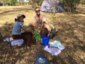We wash our laundry by hand every few days. It dries really quickly in the hot sun and dry heat!