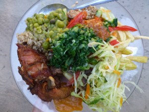 Delicious food from a catered meal: njgere, kachumbali, mchicha, kuku, pilau, kabichi. Yum!